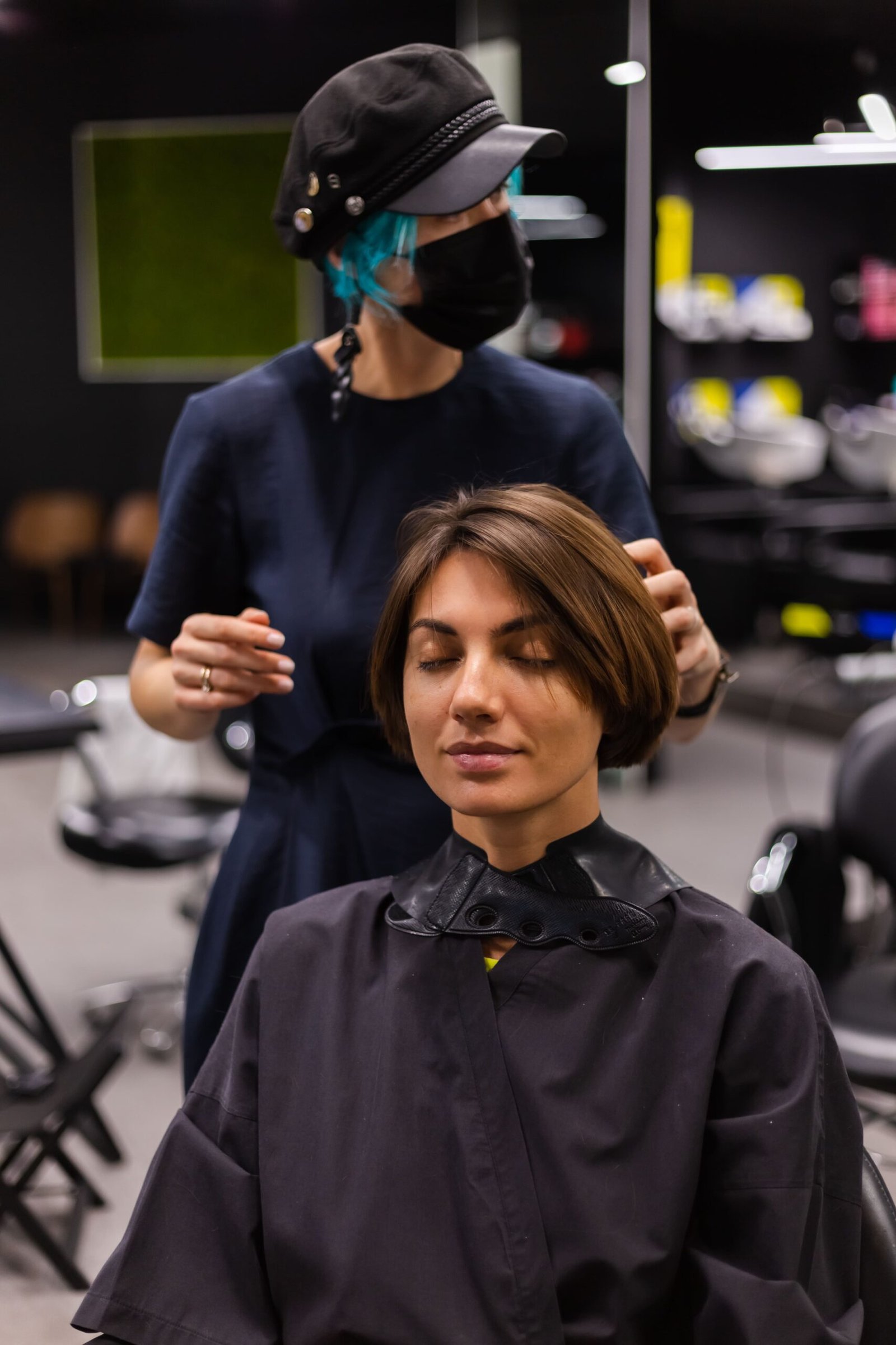 professional-girl-hairdresser-makes-client-haircut-girl-is-sitting-mask-beauty-salon